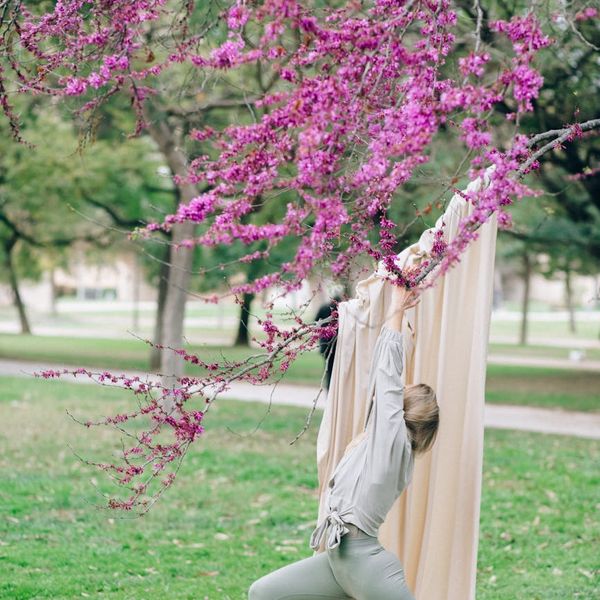 Silhouette of a person stretching during sunrise, symbolizing energy and renewal.